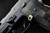 Sig Sauer P320 AXG Magazine Release Kit shown mounted on a handgun