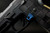 Sig Sauer P320 AXG Magazine Release Kit shown mounted on a handgun in blue