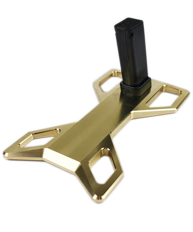 Isolated gun stand with a gold base.