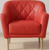 UL#21 Poppy Leather shown on Velvet Armchair