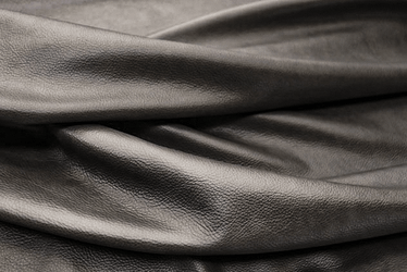 Closeup picture of Alley Cat soft, dark grey colored upholstery leather for furniture