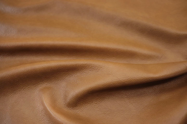 Closeup picture of Autumn Leaves soft, warm gold colored upholstery leather for furniture
