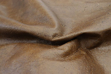 Close up picture of Back Country Brown, a rustic brown  leather and nap texture.