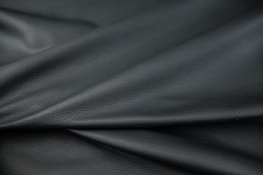 Close up of deep navy blue pigmented leather for upholstery