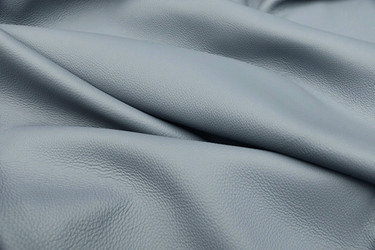 Close-up picture of Big Sky, sky blue full grain leather for upholstery with pebble grain texture
