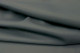 Close-up picture of Midnight Moss, deep forest green colored Italian leather for upholstery.