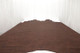 Redwood distressed leather hide for upholstery displayed on a table