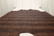 Mojave Lizard faux lizard leather hide for upholstery displayed on a table. 