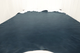 Picture of deep blue upholstery leather hide laying flat on a table