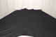 Picture of a rich black top grain upholstery leather displayed on a table
