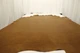 Picture of golden amaretto full grain leather for upholstery displayed on a table