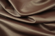 Close up picture of rich plum pigmented leather for upholstery