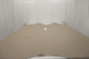 Picture of Seattle, taupe colored leather hide for upholstery displayed on a table

