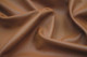 Close-up picture of Caramel soft rich brown leather for upholstery with natural grain texture