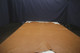 Picture of Gold Distress full grain leather hide for upholstery displayed on a table