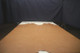 Picture of Wicker Distress full grain leather hide for upholstery displayed on a table