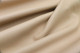 Close-up picture of Bisque, warm tan full grain leather for upholstery with pebble grain texture