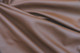 Close-up picture of Maple, saddle brown genuine leather for chairs, sofas and other furniture upholstery 
