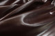 Close-up picture of Restoration Espresso soft, Italian leather for upholstery with smooth grain texture