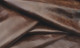Close-up picture of Chocolate Distress leather for upholstery with waxy finish