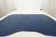 Genuine blue leather suede displayed on a table 
