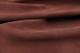Closeup picture of soft cinnamon brown suede showing texture of leather