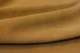Closeup picture of soft marigold yellow suede showing texture of leather