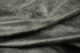 Close up picture of cool grey/black pull up upholstery leather