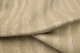 Close up of ivory with tan undertones embossed upholstery leather