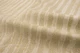 Close up of ivory with tan undertones embossed upholstery leather