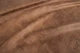 Close up of rich brown multitone distress upholstery leather