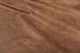 Close up of rich brown multitone distress upholstery leather