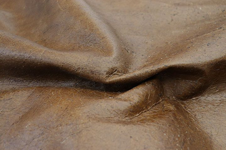 Close up picture of Back Country Brown, a rustic brown  leather and nap texture.