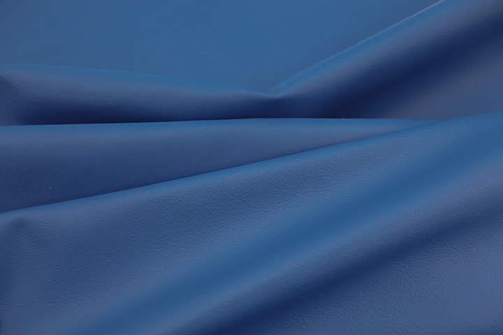 Close up picture of dark electric blue smooth Italian leather for upholstery