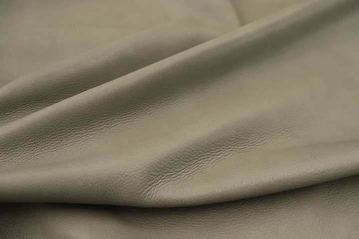 Close up picture of medium grey full grain leather for upholstery