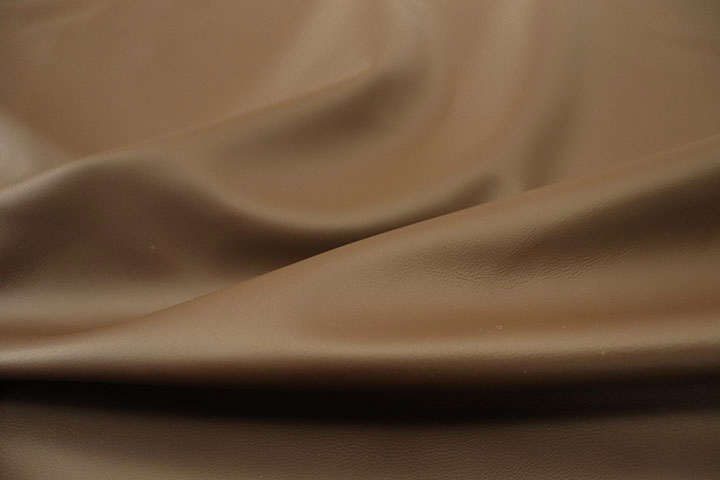 Close up picture of dark otter brown Italian leather for upholstery