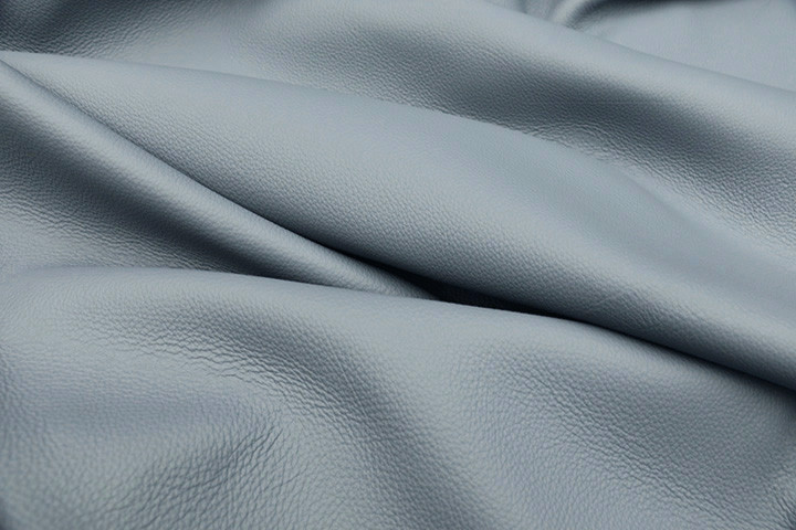 Close-up picture of Big Sky, sky blue full grain leather for upholstery with pebble grain texture