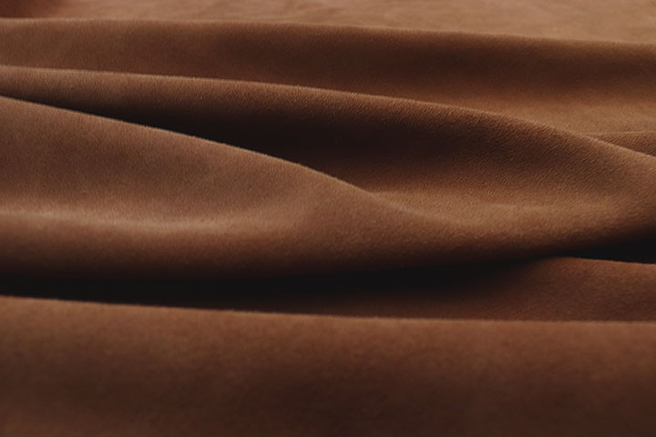 Closeup picture of soft Brandy suede showing texture of leather