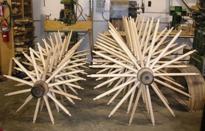 Wooden wagon hubs with new spokes inserted