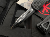 Microtech Hera D/E Frag Pattern Black Aluminum Body w/ Black Tactical Full Serrated Blade (3”) 702-3TFRS
