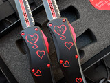 PRE-OWNED Microtech Hera D/E Signature Series “Twin Flames” Set of Two Knives Black Aluminum Body  w/ Red Accents and Full Serrated Blade (3.08”)