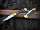 Buck Knives 110 Folder Brass and Ebony Body w/ 420HC Satin Plain Edge Blade (3.75") 0110BRS-B