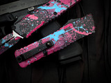 Microtech Combat Troodon D/E Gen III Signature Series Black/Pink Light Blue Splatter Cerakote Aluminum Body w/ M390Mk Splattered Plain Edge Blade (3.8") 1142-1BKPKLBSPLS