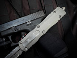 PRE-OWNED Microtech Dirac Delta D/E Natural Clear Aluminum Body w/ Apocalyptic Double Full Serrated Blade (3.8") 227-D12APNC
