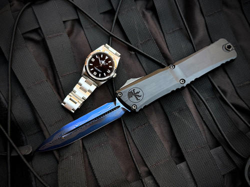 Microtech Combat Troodon D/E Marfione Select Black Hefted Alloy Body and DLC Hardcut/Blue Titanium Hardware w/ Blued Baker Forge Coppermai Damascus Plain Edge Blade (3.8") 1142-16MS1