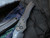 Heretic Knives Wraith S/E Auto Folder Black Body and Carbon Fiber Bolster w/ Blued Titanium Pivot Collar H000-4A-T