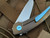 Hog House Knives Model T Bronzed Titanium Body w/ Light Blue Anodized Titanium Hardware and Blasted RWL-34 Blade (3.36”) HHK-T-BR-BZLBL
