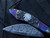 William Henry B12 'Buffalo Nickel III' Folder Blued Twist Damascus Body w/ Hand Carved Silver Inlays, Buffalo Nickels, and Hornets Nest Chad Nichols Damascus Plain Edge Blade (3.06”)