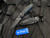Benchmade Mini Osborne Axis Lock Folder Black/Blue G10 Body w/ S30V Black Plain Edge Reverse Tanto Blade (2.92”) 945BK-1