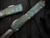 Microtech Ultratech D/E NCKS 2023 Signature Series Teal/Green Guitar Motif Body w/ Apocalyptic Plain Edge Blade (3.4") 122-10APNCKS